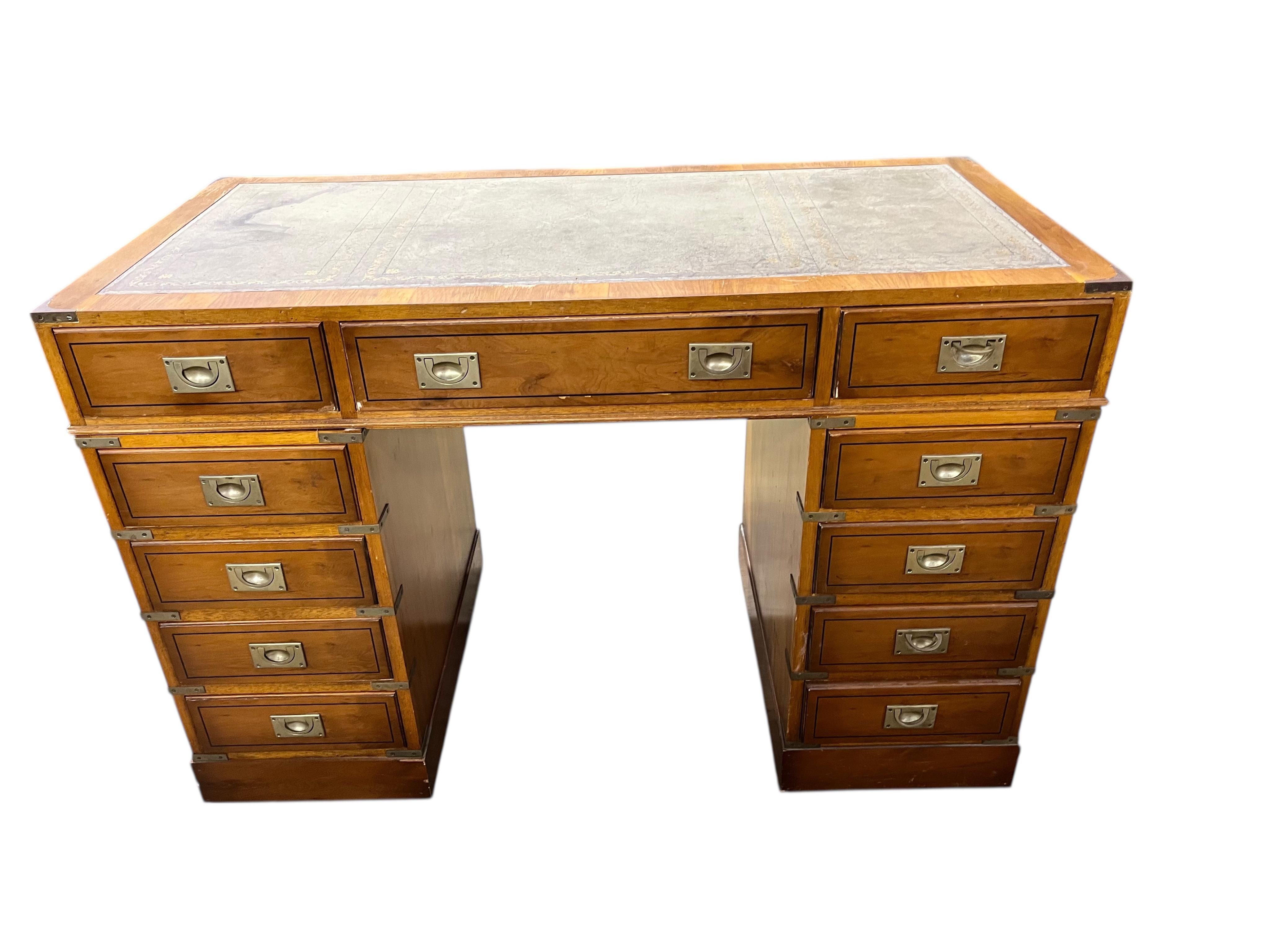 A reproduction yew military style pedestal desk, width 119cm, depth 58cm, height 79cm